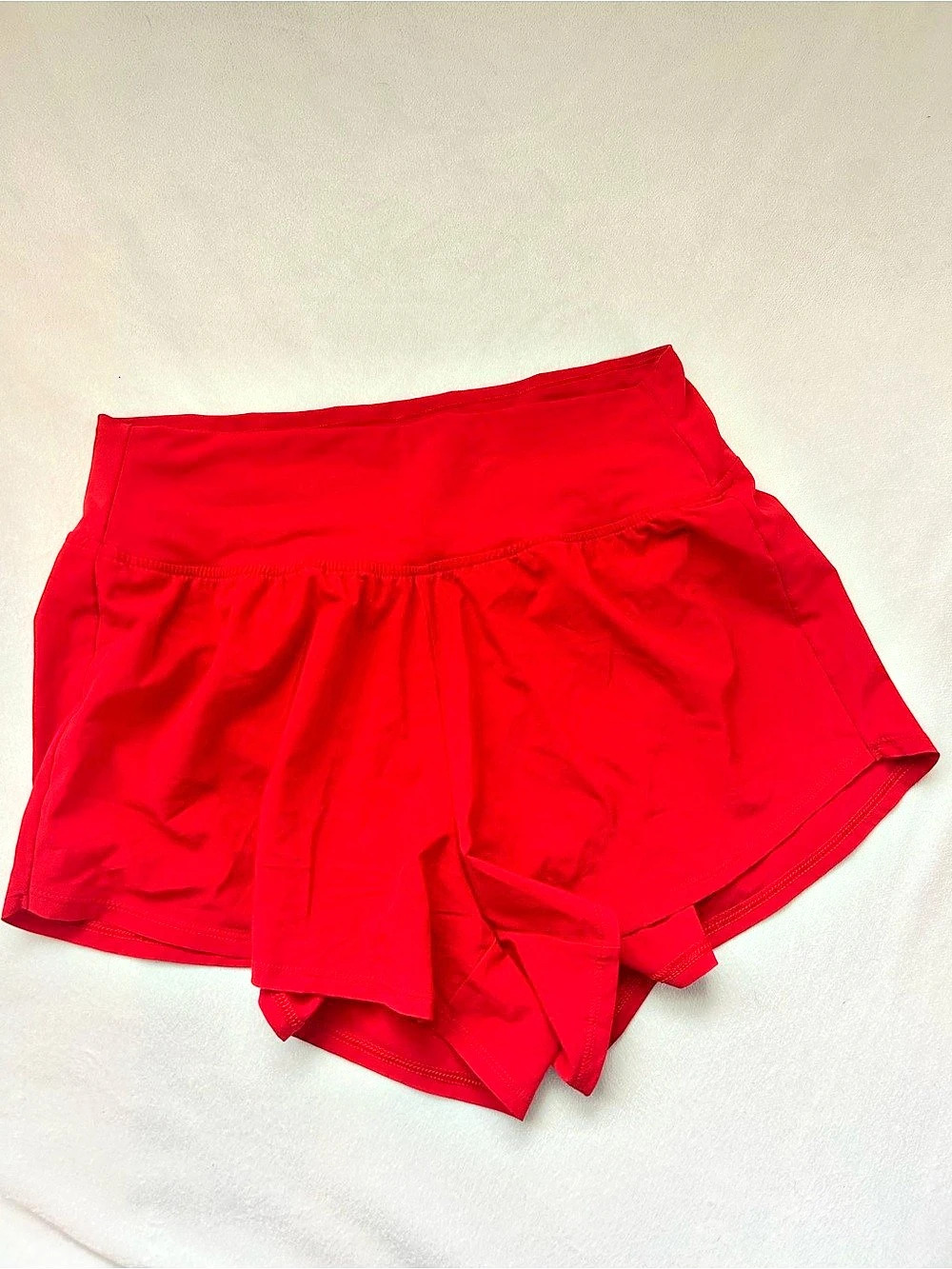 DSG women’s medium 3” performance stride shorts. Cherry Ice red